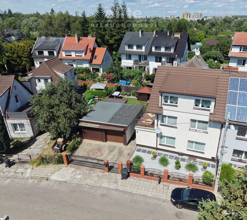 Dom na Gumieńcach, taras, garaże, Park Przygodna